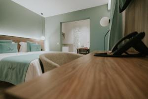 A bed or beds in a room at Catalina Plaza Hotel Sostenible