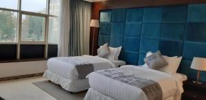 Letto o letti in una camera di Three Points Al Salama