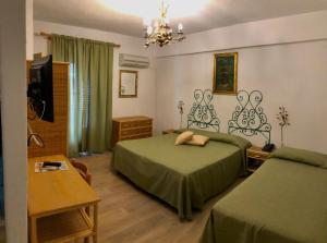 Postel nebo postele na pokoji v ubytování Hotel da Peppe
