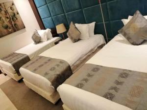 Letto o letti in una camera di Three Points Al Salama