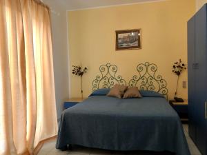 Postel nebo postele na pokoji v ubytování Hotel da Peppe