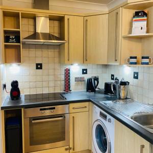 a kitchen with a sink and a dishwasher at Beverley Snug in Beverley