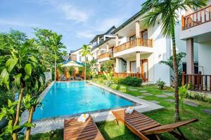 an image of a swimming pool in front of a house at Mộc Lam Bungalow Phú Quốc in Phu Quoc