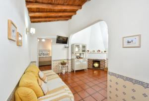 a living room with a couch and a fireplace at CASA DA ALDEIA II in Alcaria Ruiva