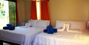 En eller flere senger på et rom på Hotel Turístico Marian