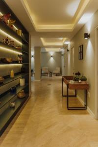 a hallway with a table in a room at Kokoa Hotel Cusco in Cusco