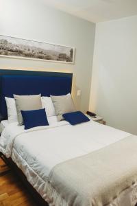 Rúm í herbergi á Kokoa Hotel Cusco