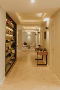 a hallway with a table and a living room at Kokoa Hotel Cusco in Cusco