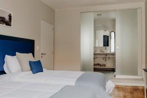 Rúm í herbergi á Kokoa Hotel Cusco