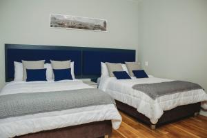 Rúm í herbergi á Kokoa Hotel Cusco