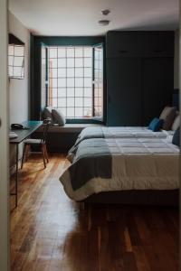 Rúm í herbergi á Kokoa Hotel Cusco