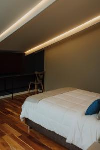 Rúm í herbergi á Kokoa Hotel Cusco