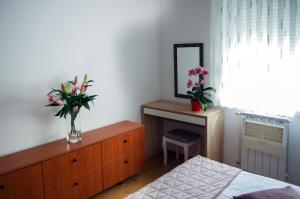 Postel nebo postele na pokoji v ubytování Apartman Dada