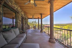 a large porch with a couch on a balcony at Unique Phoenix Abode with 2-Tier Patio and Grills in Anthem