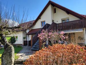 a house with a staircase in front of it at Pension am Wald in Gößweinstein