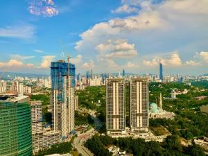 an aerial view of a city with tall buildings at Duplex Corner Unit Arte Mont Kiara 2BR in Kuala Lumpur