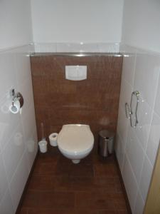 a small bathroom with a toilet in a stall at Ferienhof Grossgrub in Vorderstoder