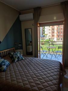 Postel nebo postele na pokoji v ubytování B&B CasaBuddace