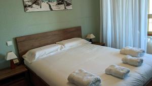 a bedroom with a bed with two towels on it at Tortuga Flat in Alicante +48 photos