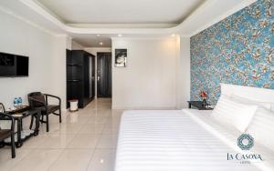 Postel nebo postele na pokoji v ubytování La Casona Hotel