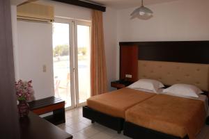 Postel nebo postele na pokoji v ubytování Corali Hotel