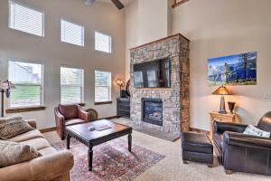 a living room with a fireplace and a tv at Midway Getaway 17 Miles to Park City Resort! in Midway