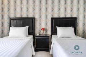Postel nebo postele na pokoji v ubytování La Casona Hotel