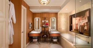 a bathroom with two sinks and a bath tub at Wynn Las Vegas in Las Vegas