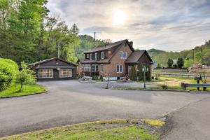 a large brick house with a driveway at Lynn Dog-Friendly Abode with Mountain Views! in Hagerhill