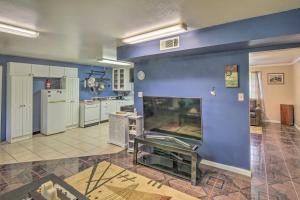 a large living room with a blue wall at Gulf Coast Home Less Than 2 Mi to Parks and Museums! in Orange