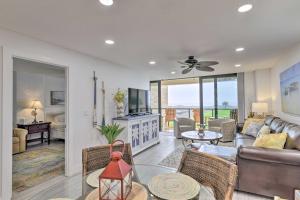 a living room with a couch and a table at Condo Walk to Beach, 3 Miles to Port Aransas! in Port Aransas