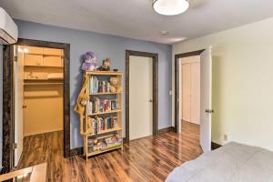 a bedroom with a book shelf with books at Vibrant Weaverville Escape with Deck and Creek! in Weaverville