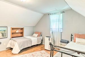 a bedroom with two beds and a window at Fragola House - Family-Friendly Getaway! in Clifton Heights