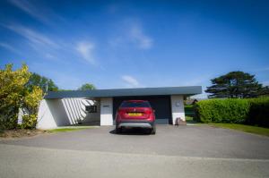 a car is parked in a garage at Allen Ridge in Hythe