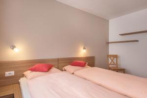 A bed or beds in a room at Hilber App Sass Rigais