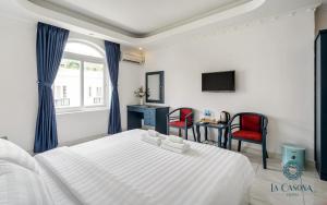 Postel nebo postele na pokoji v ubytování La Casona Hotel