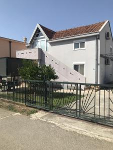 a fence in front of a house at Taida in Donji Štoj