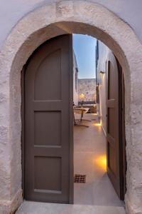 an archway leading to a door in a building at VaSan suite in Rethymno