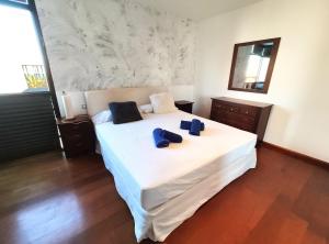Łóżko lub łóżka w pokoju w obiekcie Villa Paula Costa Teguise