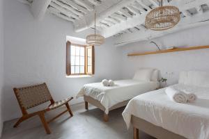 A bed or beds in a room at Casa Santiago House Boutique