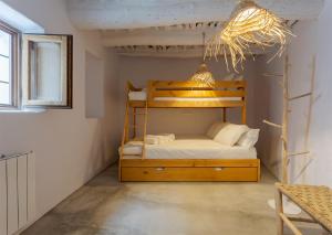 A bed or beds in a room at Casa Santiago House Boutique