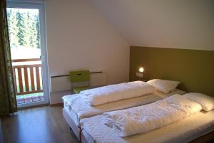 Postel nebo postele na pokoji v ubytování Villapark Lipno Dreams - pet friendly