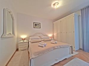 Postel nebo postele na pokoji v ubytování Apartment Nina Marie II