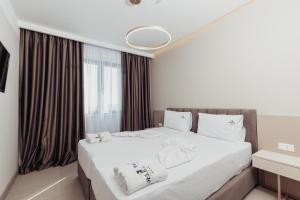 Postel nebo postele na pokoji v ubytování Delight Hotel & SPA