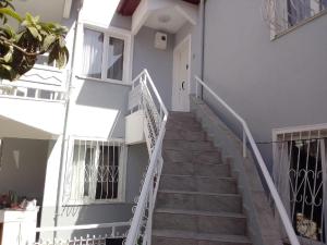 a staircase leading up to a white building at Atamert Homes in Kemer