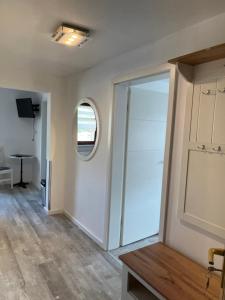 an empty room with a sliding door and a window at Pension Eckert in Zwenkau