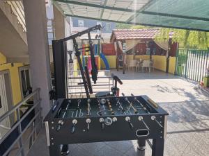 a gym with a bunch of tools on a machine at Apartments Maja in Star Dojran