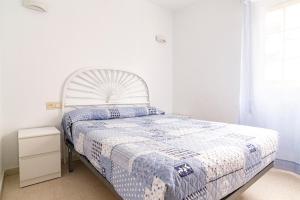 Posteľ alebo postele v izbe v ubytovaní Apartamento Málaga Agreda