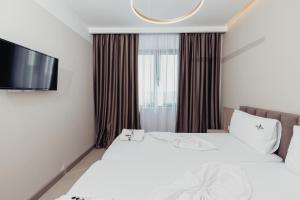 Postel nebo postele na pokoji v ubytování Delight Hotel & SPA