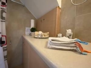 a bathroom with a white towel on a counter at Two-storey Mansion at the Sea in rkadiko Chorio +72 photos